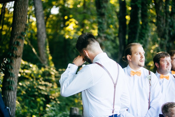 Micah's best man prompted him to turn around as his bride came down the aisle. 