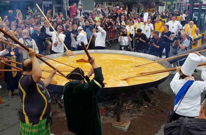 Members of the Worldwide Fraternity of the Omelette prepare a traditional giant omelette made with 10,000 eggs in Malmedy, Belgium August 15, 2017.