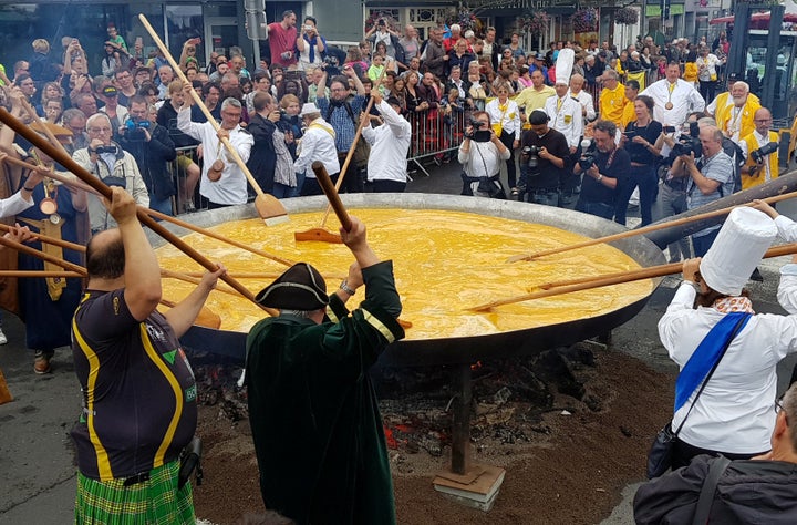 Members of the Worldwide Fraternity of the Omelette prepare a traditional giant omelette made with 10,000 eggs in Malmedy, Belgium August 15, 2017. 