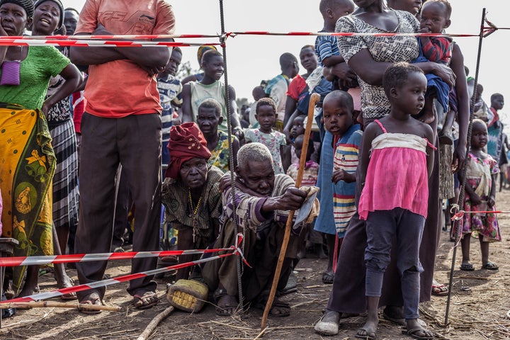 Refugees wait in line at the entrance of the medical post operated by Medical Teams International at Palorinya refugee settle