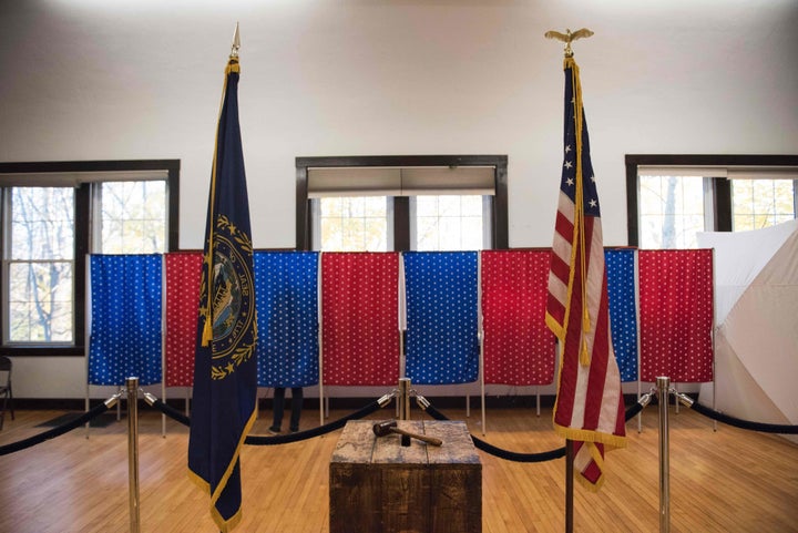 A person votes inside a voting booth in Newfields, New Hampshire, on Nov. 8, 2016. President Donald Trump has said that thousands of people were bused into the state to vote on Election Day, but hasn't provided any evidence to back up his claim.