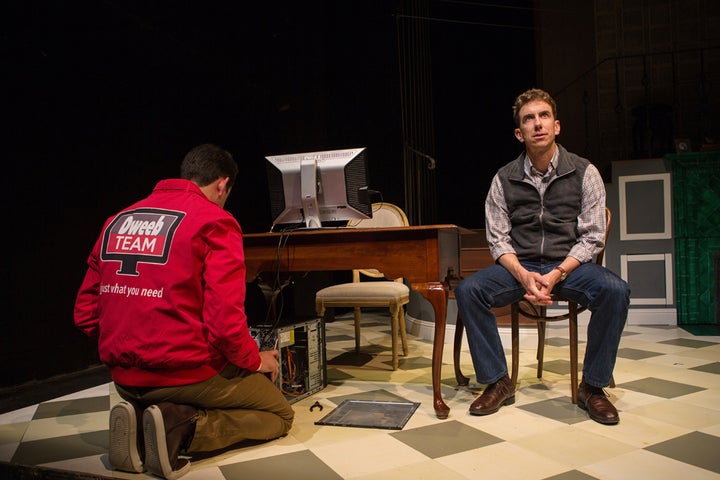 <p>Merrick (Mick Mize) plots to get back at his wife while an unassuming technician from the Dweeb Team works on his computer in a scene from <strong><em>The (curious case of the) Watson Intelligence</em></strong> </p>