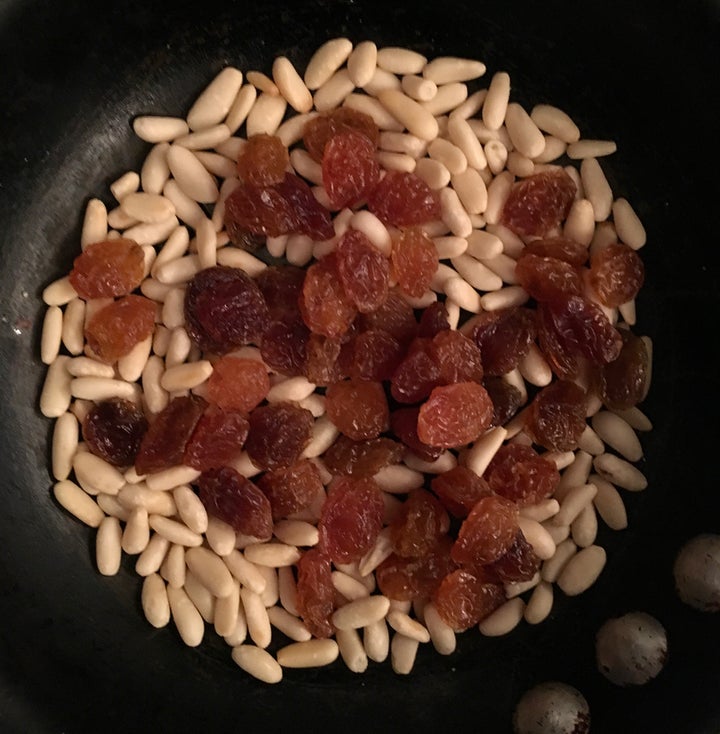 <p>White raisins and lightly toasted pine nuts</p>