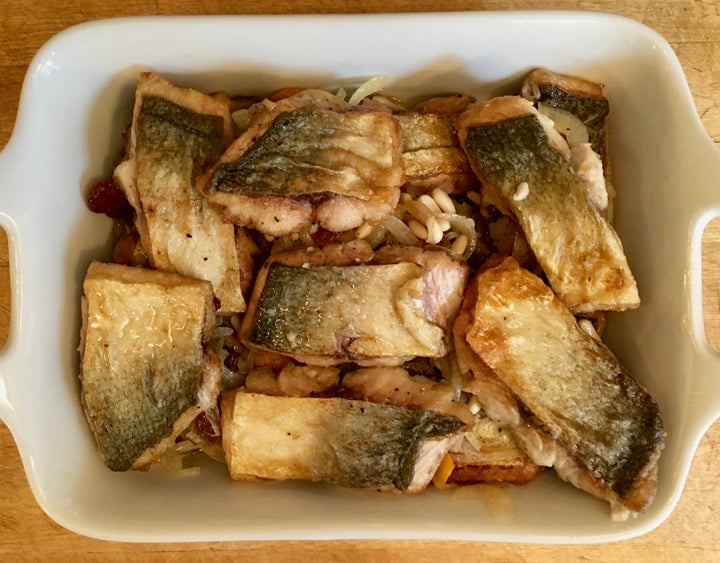 <p>Layer the onion-vinegar mixture and the fish</p>