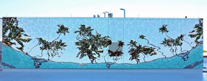 Nice’n Easy. A collaborative endeavor by artists Allison Matherly and Jeffrey Noble focused on mixed media installations that play on the subtropical vernacular with added perspectives, tropes, and collective emotions. At CIC Miami, they created an external mural that creates an illusion when looking outside from one of our kitchens.