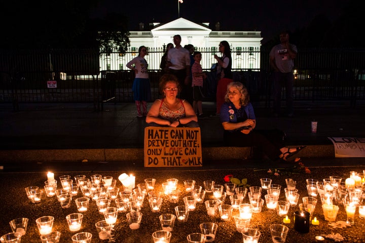 People gather in front of the White House on Aug. 13, 2017, in Washington, D.C., for a vigil in response to the death of Heather Heyer, who was killed when a driver drove into a crowd of counterprotesters in Charlottesville.