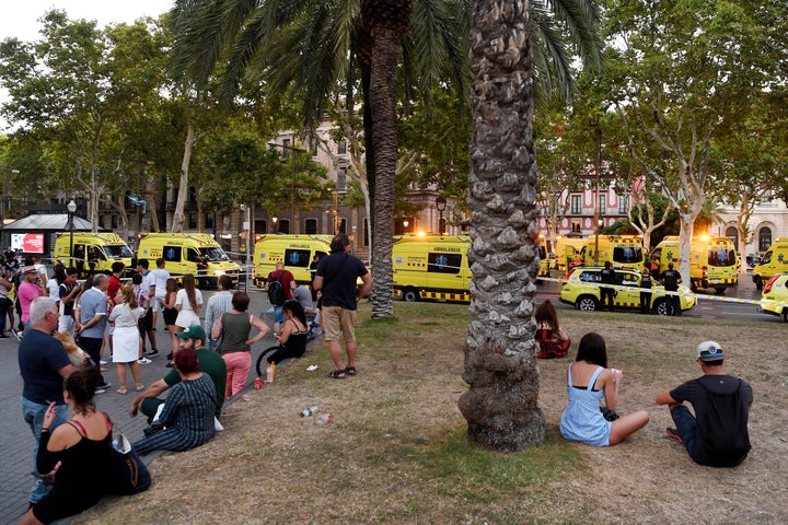 People look toward the scene of the attack