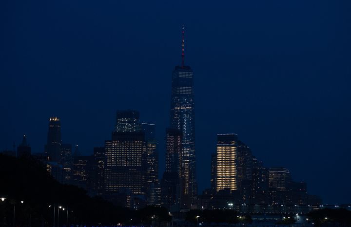 The spire atop One World Trade Center in New York City is lighted in the colors of the Spanish flag to honor the victims of the Barcelona terrorist attack Thursday.