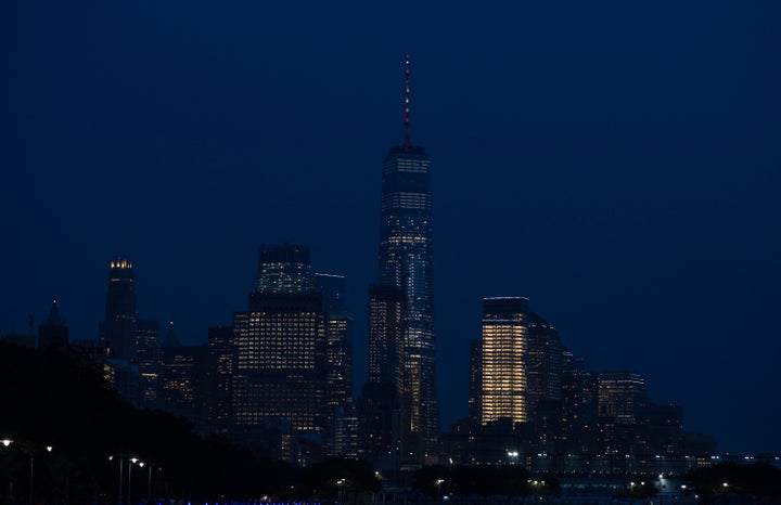 The spire atop One World Trade Center in New York City is lighted in the colors of the Spanish flag to honor the vi