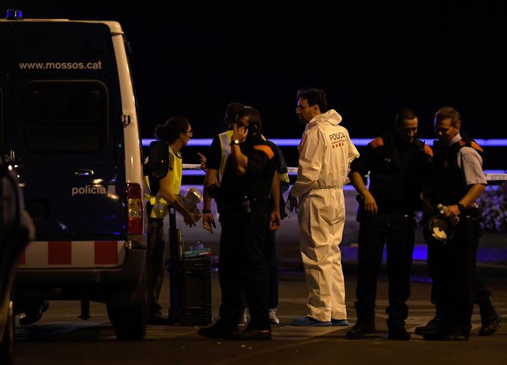 Police check the area after officers shot dead fire attackers in Cambrils 