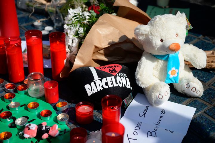 Flowers, candles, messages and stuffed toys are left on the Rambla boulevard following the attack which left 13 dead