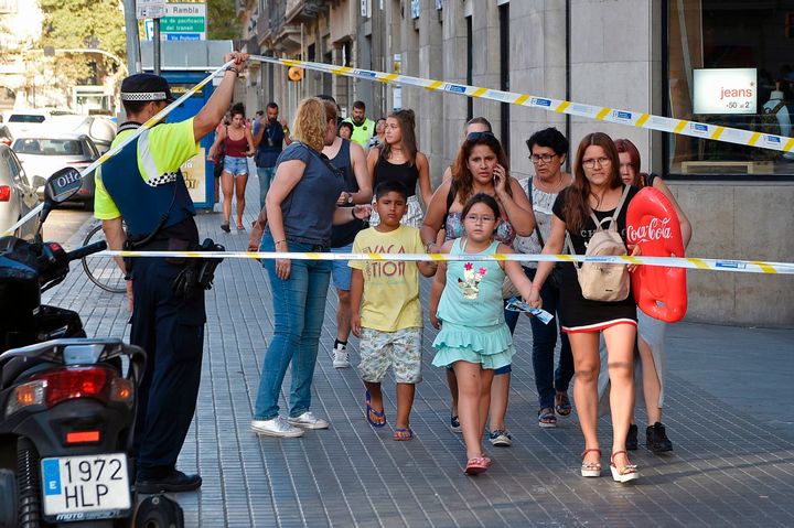 People leave a cordoned off area in Las Ramblas.