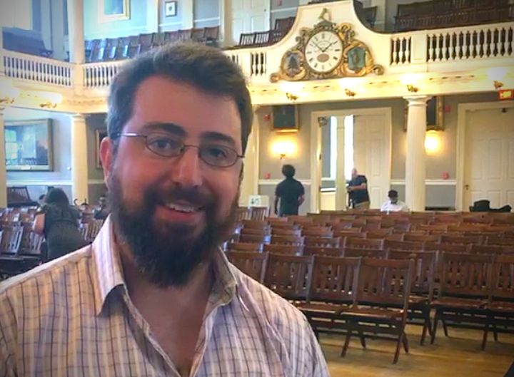 Photo caption: Jeremy Fryer-Biggs of Evaptainers poses in Fanueil Hall following the conclusion of Boston GreenFest’s International Youth Summit while conducting an interview on LAUNCH.