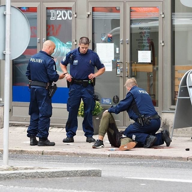 Police at the scene of a stabbing in Turku, Finland, on Friday.
