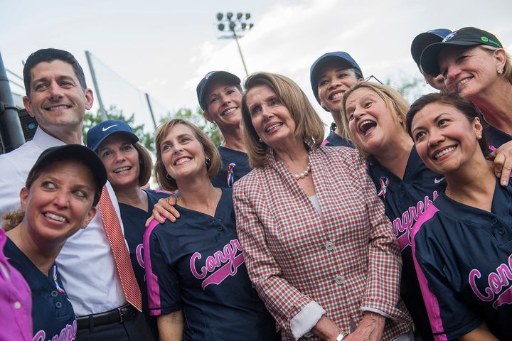  Speaker of the House Paul Ryan, R-Wis., and House Minority Leader Nancy Pelosi, D-Calif., pose with the members team before the Congressional Women’s Softball game. 