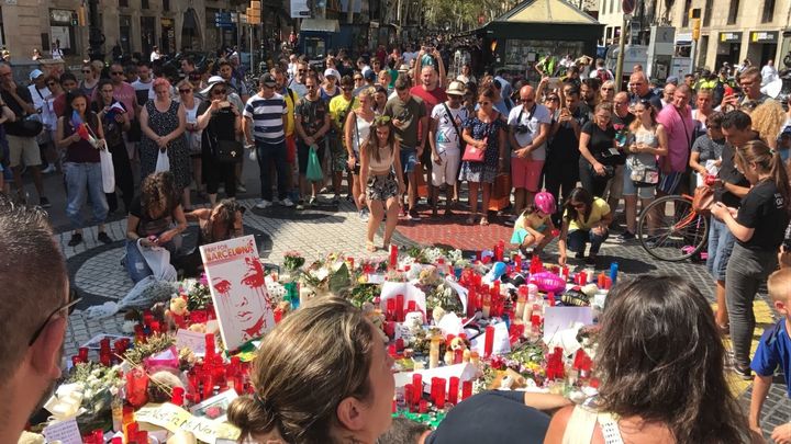 Mourners gather on Las Ramblas where the van stopped yesterday