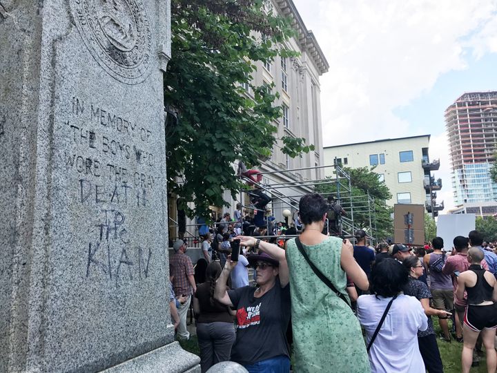 A vandalized Confederate monument reads "Death to the Klan" in Durham, North Carolina, on Friday afternoon.