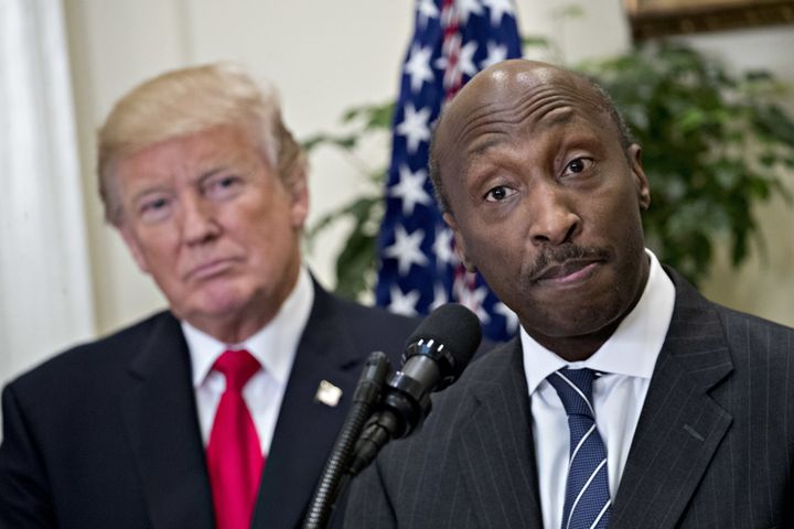Ken Frazier, chairman and CEO of Merck, speaks while U.S. President Donald Trump, left, listens during an announcement on a new pharmaceutical glass packaging initiative in the Roosevelt Room of the White House in July.
