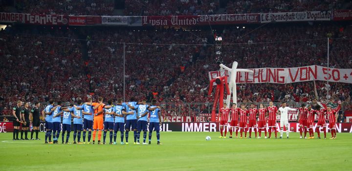 Bayern Munich and Beyer Leverkusen players during a minute silence for the victims of the Barcelona terror attack.
