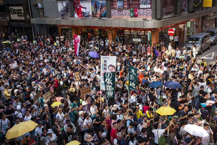 Protesters attend a rally to support young activists Joshua Wong, Nathan Law and Alex Chow in Wanchai on August 20, 2017 in Hong Kong. 