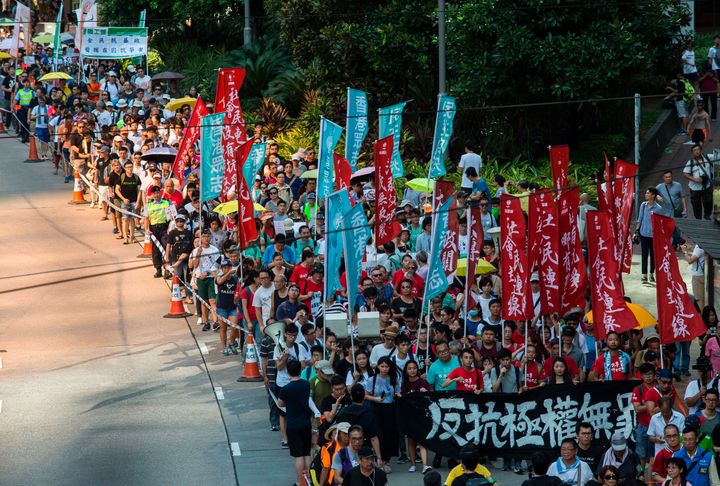 Protesters march in Hong Kong on August 20, 2017, to protest the jailing of Joshua Wong, Nathan Law and Alex Chow, the leaders of Hong Kong's 'Umbrella Movement', after their sentencing at the High Court on August 17.
