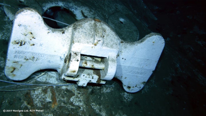 An image shot from a remotely operated vehicle shows the bottom of an anchor clearly marked US Navy and Norfolk Navy Yard.