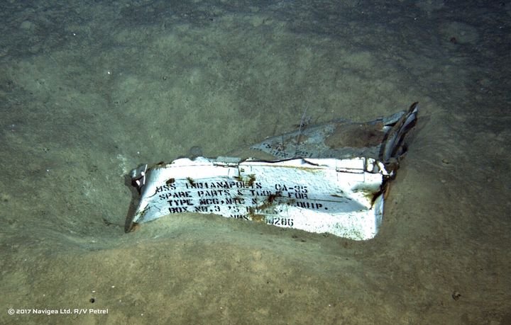 An image shot from a remotely operated underwater vehicle shows a spare parts box from USS Indianapolis on the floor of the Pacific Ocean.