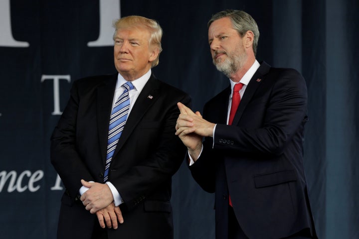 Liberty University President Jerry Falwell Jr. is seen standing with Trump following Trump's commencement speech.