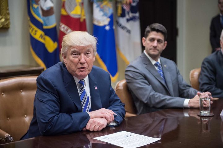 House Speaker Paul Ryan, right, released a statement condemning white supremacists, but not calling out statements on the matter from President Donald Trump.