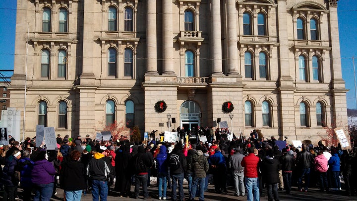 Protesters upset by the local sheriff's handling of a rape case involving two high school football players gathered in front