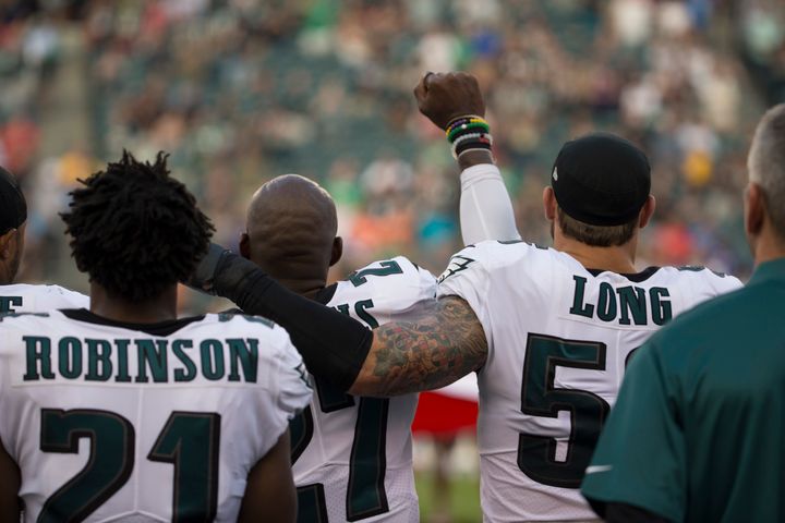 Eagles safety Malcolm Jenkins protests during the national anthem before a 2017 preseason game. Defensive end Chris Long became one of the first white NFL players to join the demonstrations.