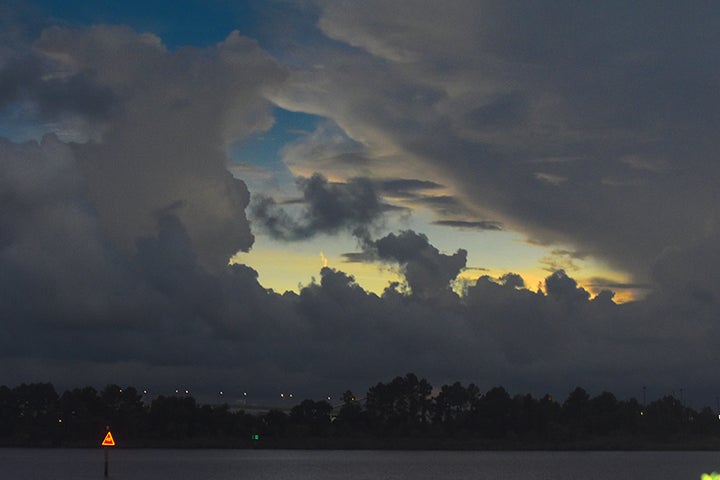 <p>A dramatic sky over Winyah Bay just seconds after totality.</p>