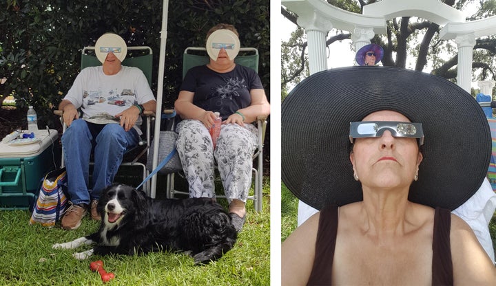 <p>Left: Tom and Bonnie Brown of Virginia Beach show off their DIY eclipse glasses made from paper plates to block the entire face from the eclipsing sun rays. They even had eclipse glasses for their dog, Butler. Right: Robin Richardson of Apex, N.C. looks to the sun as the eclipse begins.</p>