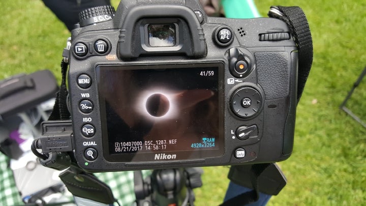 Phone snap of Linda Joy’s Nikon’s viewing monitor showing the glowing ring of the sun. 