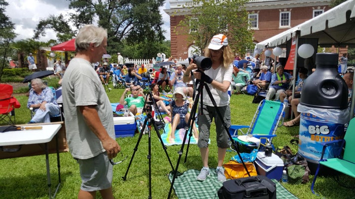 Science writer and amateur photographer Linda Joy sets up her camera for a once-in-a-lifetime photo op. 