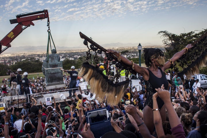 Students cheer as the Cecil Rhodes statue is removed from the University of Cape Town on April 9, 2015, in Cape Town, South Africa.