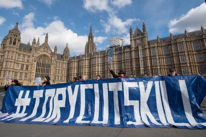 Disabled People Against Cuts protest outside Parliament against government cuts to Personal Independent Payments