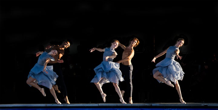 Ballet Dancers gracefully prancing across the stage