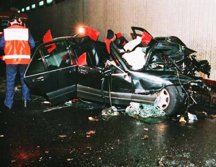 Photographers and emergency workers at the scene of the crash. Diana was still alive at this point and being pictured by paparazzi as she lay in the back seat of the car, having suffered fatal injuries 