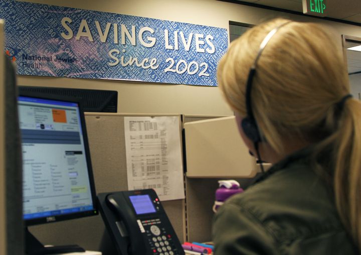 A tobacco cessation coach speaks to a quitline caller at National Jewish Health in Denver, Colorado, the largest non-profit quitline in the U.S.