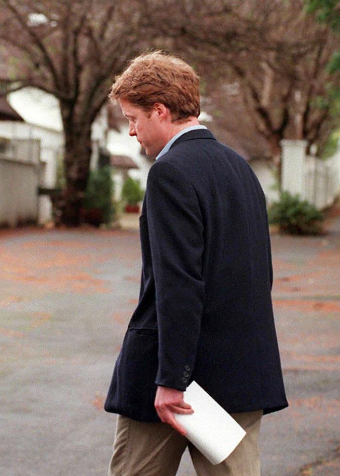 Princess Diana's brother, Earl Spencer turns away from the press after reading a brief statement about his sister's death at the entrance to his home in Constantia, Cape Town 