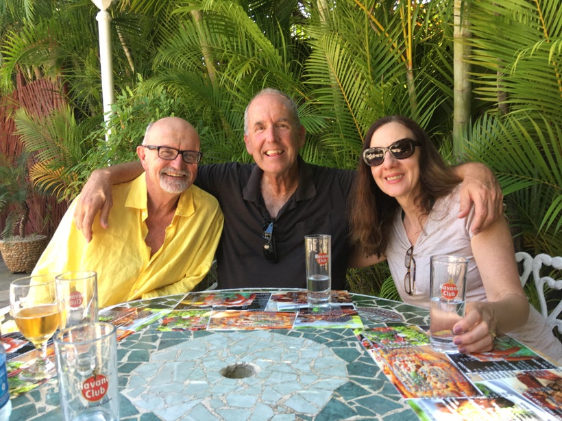 Author Steve Chapple, Cuban-American attorney Manuel Ramos, and Ines Salgado Chapple finish off the flan at El Bacura outside