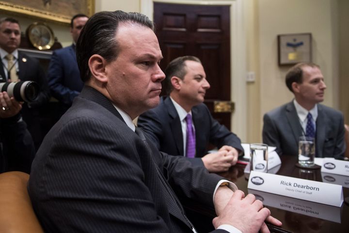 Deputy chief of staff Rick Dearborn, left, listens as President Trump speaks during a healthcare discussion with key House Committee Chairmen in the Roosevelt Room at the White House on Friday, March. 10, 2017.