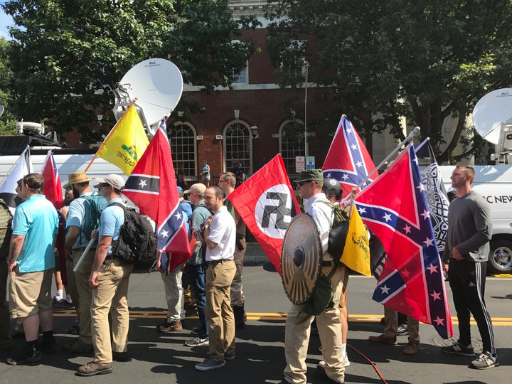 WHITE SUPREMACIST MARCHERS IN CHARLOTTESVILLE PROUDLY CARRIED NAZI AND CONFEDERATE FLAGS AS THEY PROTESTED THE REMOVAL OF CONFEDERATE STATUES.