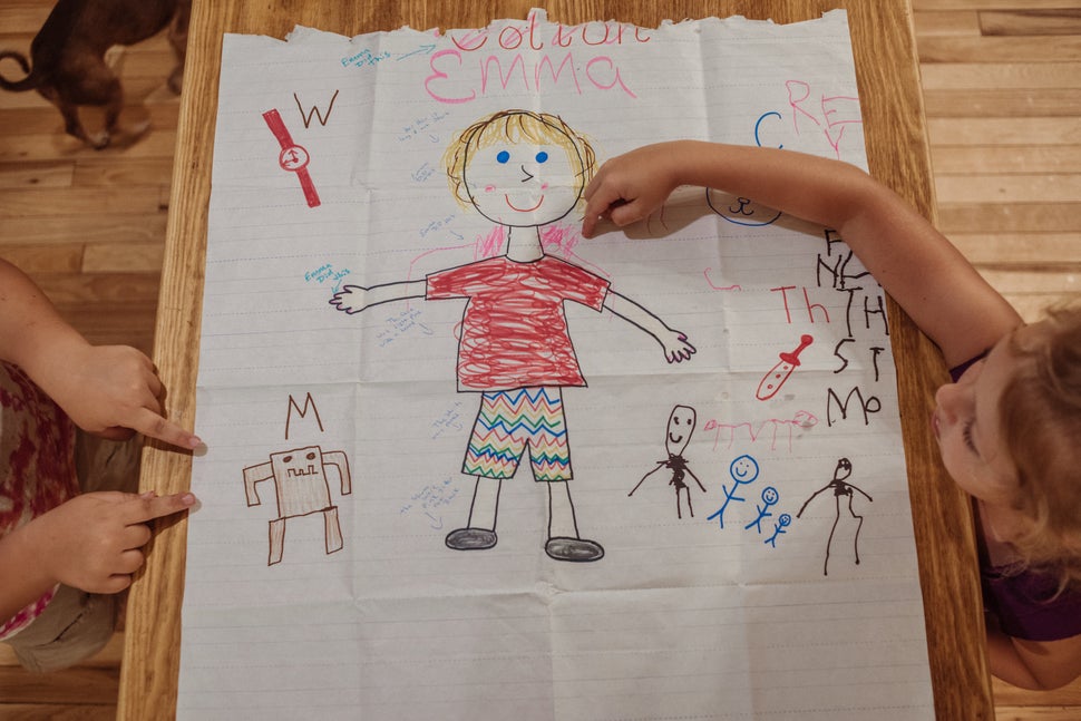 Emma's now-edited "About Me" day drawing. Phrases were added after the fact like "her hair is long not short," "the
