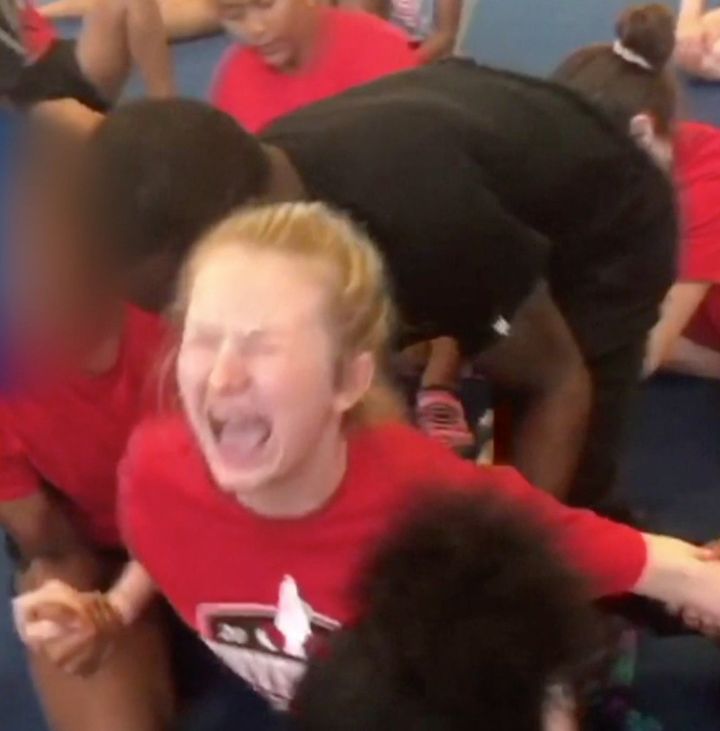 Shocking video of a 13-year-old girl being forced into splits has led to a police investigation.