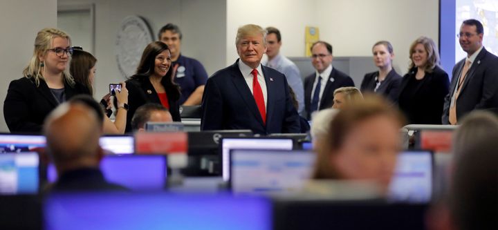 President Donald Trump tours Federal Emergency Management Agency headquarters after an Aug. 4 briefing on hurricane season.