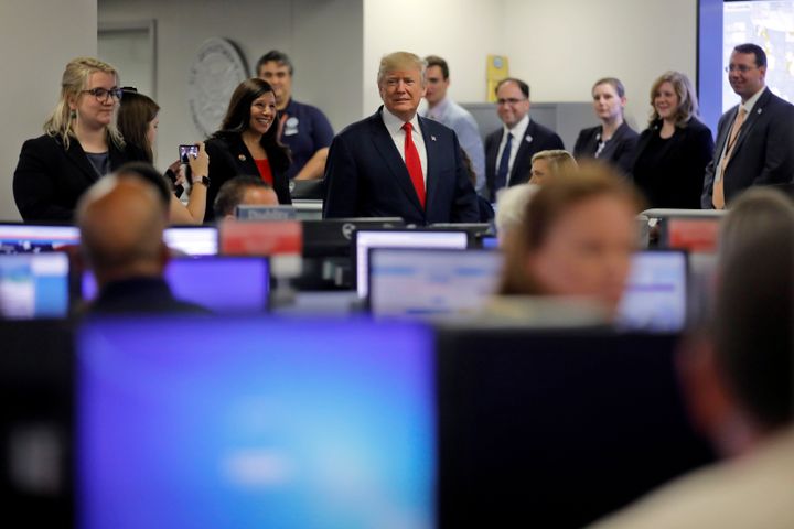 President Donald Trump tours Federal Emergency Management Agency headquarters after an Aug. 4 briefing on hurricane season.