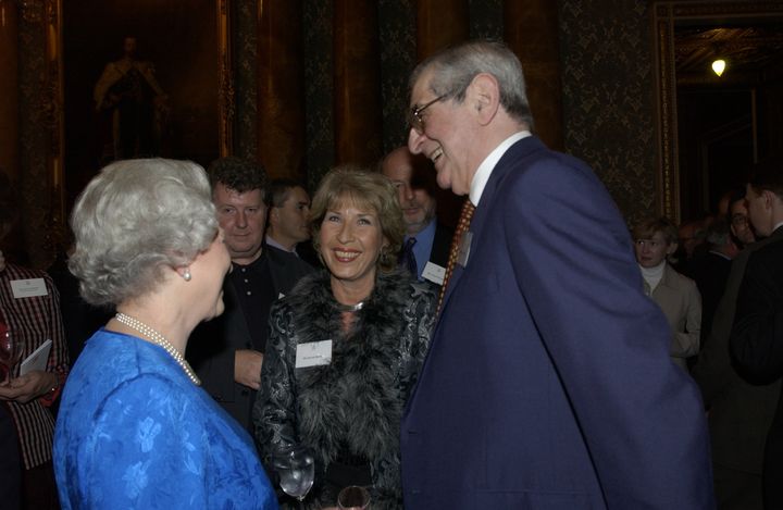 Bond and TV presenter Denis Norden with the Queen at a reception for the British broadcasting industry in Buckingham Palace
