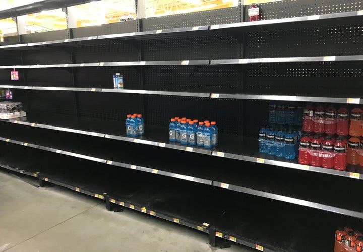 Store shelves in a Houston-area Walmart sit empty Friday, ahead of Hurricane Harvey.